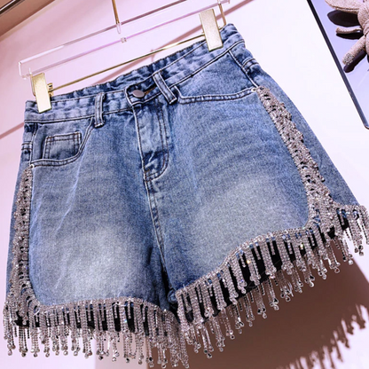 Comfortable women's denim shorts in blue, featuring a stylish design ideal for summer fashion & everyday style.