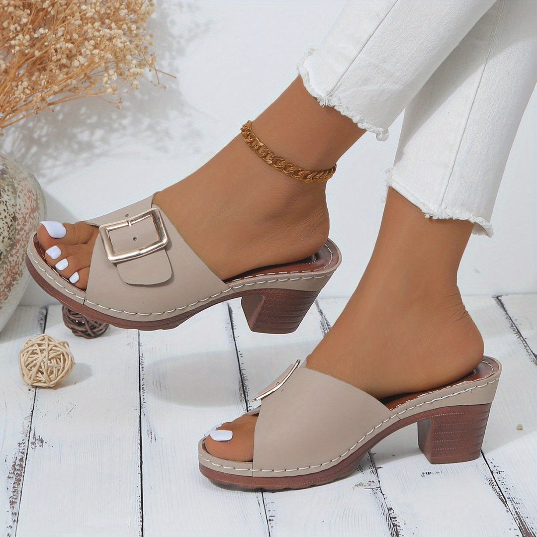 Feet wearing stylish women's comfort sandals; lightweight and open-toe for everyday wear.