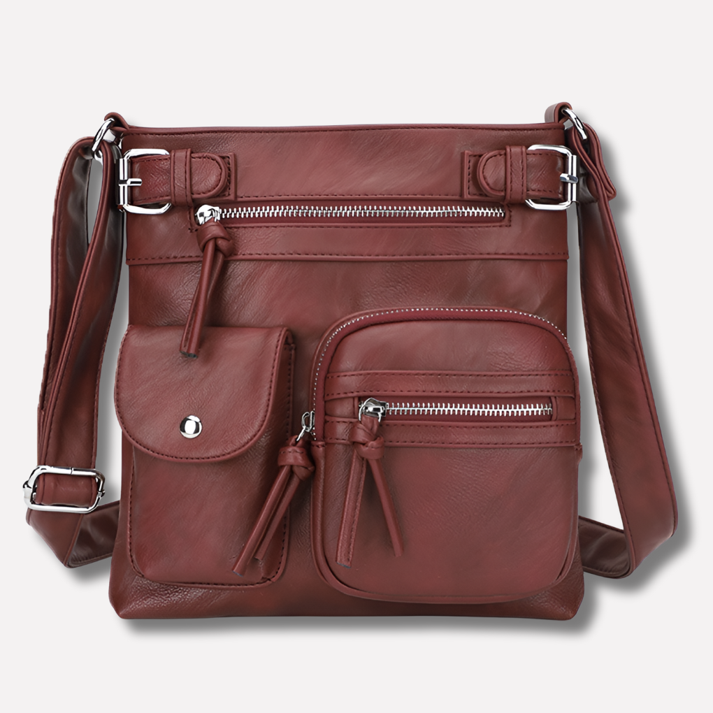 Grey versatile women's crossbody bag, offering secure storage with its multiple organized pockets.