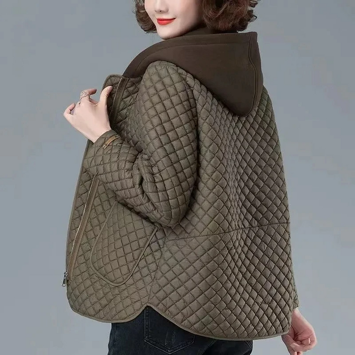 Women's stylish diamond-quilted jacket with asymmetrical hem and side zip, perfect for transitional weather.