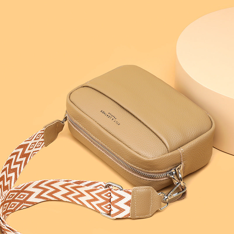 Versatile women's purse: a compact crossbody bag with designer quality finish.
