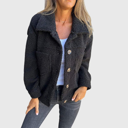 Full-length view of a trendy women's fall jacket with button closure, practical pockets & chic design.