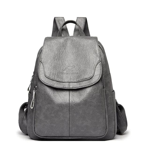 Fashionable women's flap backpack, a chic structured bag for daily use, offering style and everyday functionality.