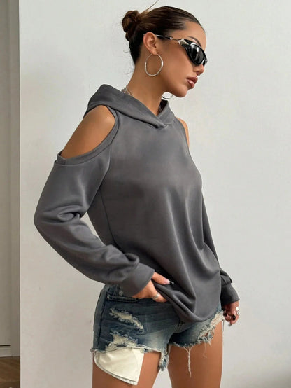 White off-shoulder women's sweatshirt, a stylish and comfortable top for relaxed everyday fashion.