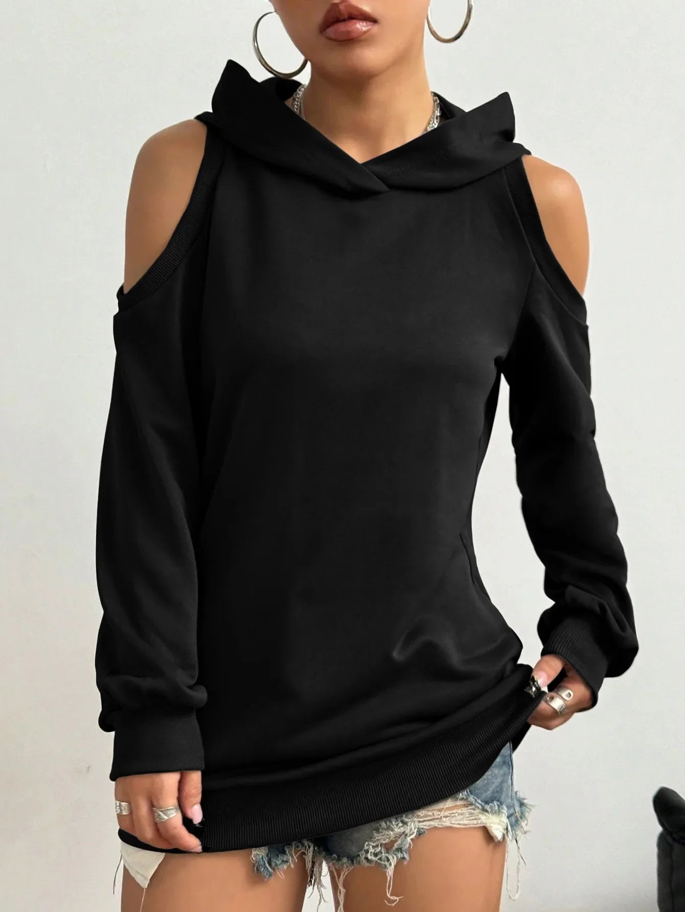 Fashionable black women's off-shoulder hoodie, a comfortable relaxed-fit sweatshirt for casual chic.