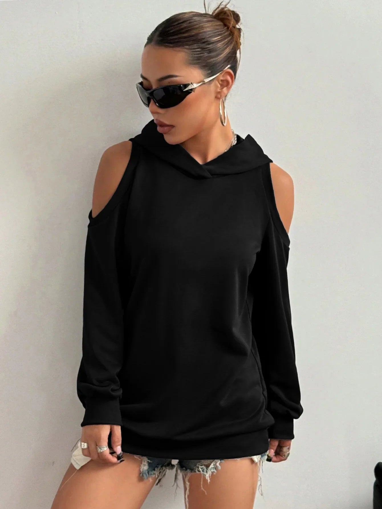 Women's stylish white off-shoulder sweatshirt, a comfy cutout top for chic casual fashion.