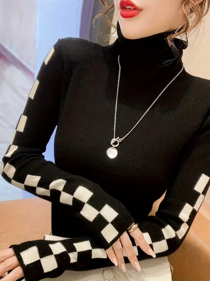 Fashionable women's high-neck sweater with check sleeves, styled for an elegant casual winter outfit.