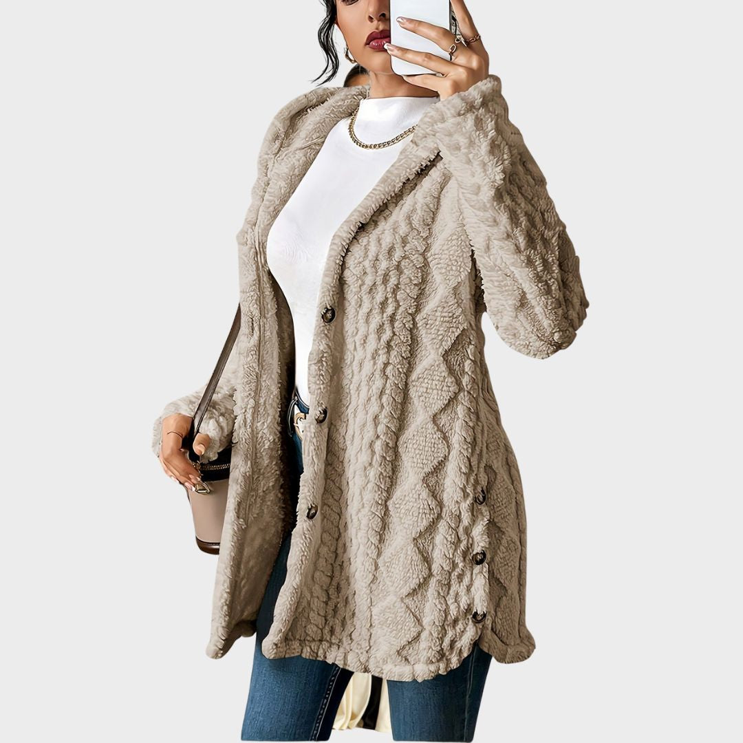 Elegant women's long hooded coat, textured fabric, button closure for winter outerwear.