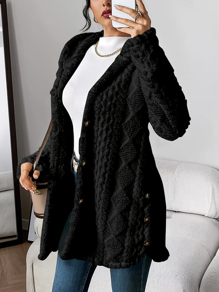 Women's elegant long hooded coat with distinctive button details, suitable for winter.