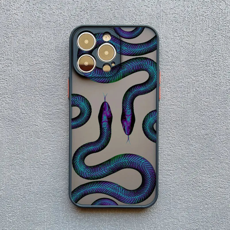 Women's luxury phone accessory: stylish iPhone case with an intricate serpent motif pattern. Slim & protective.