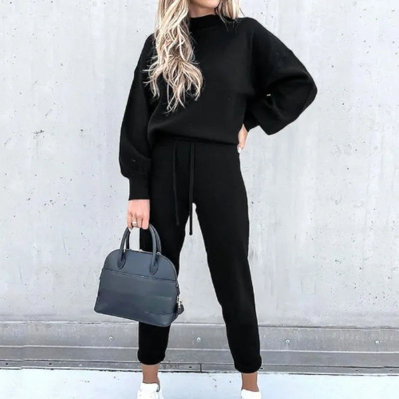 Fashionable women's mock neck two-piece set featuring balloon sleeves & drawstring lounge pants.
