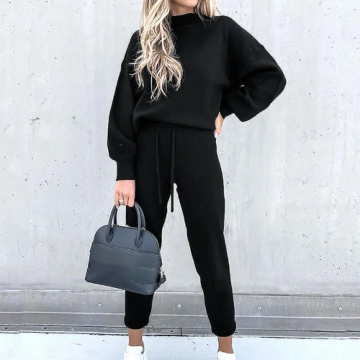 Fashionable women's mock neck two-piece set featuring balloon sleeves & drawstring lounge pants.