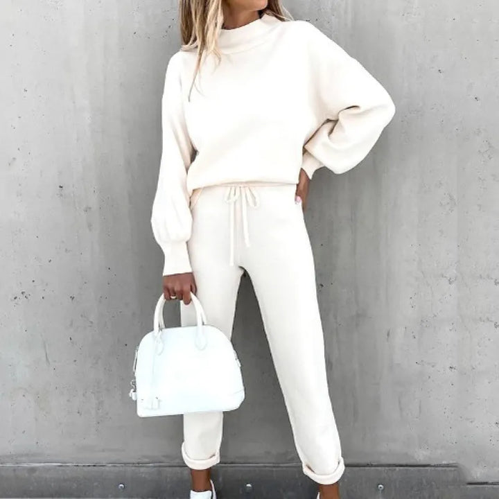 Soft women's mock neck 2-piece lounge set with comfy drawstring pants & stylish balloon sleeves.