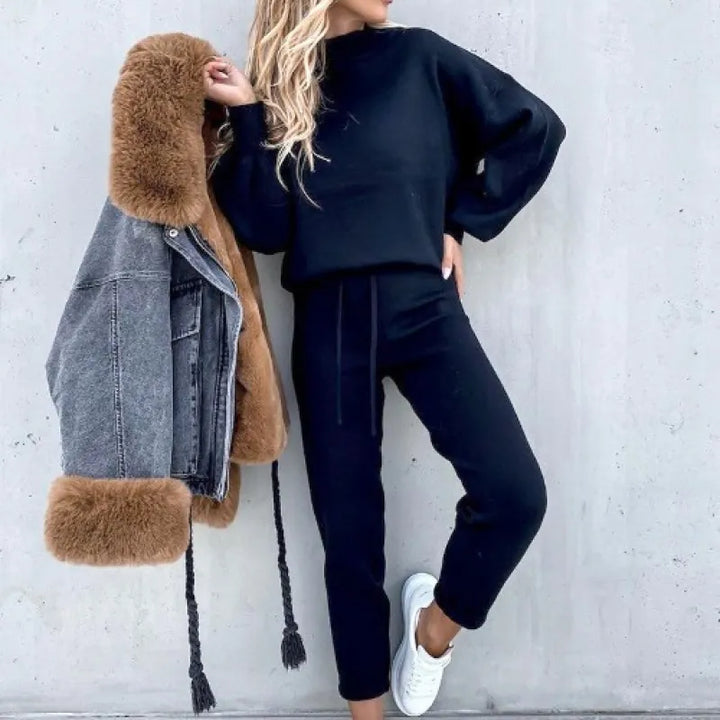 Modern women's mock neck two-piece set, featuring drawstring lounge pants & chic balloon sleeves.