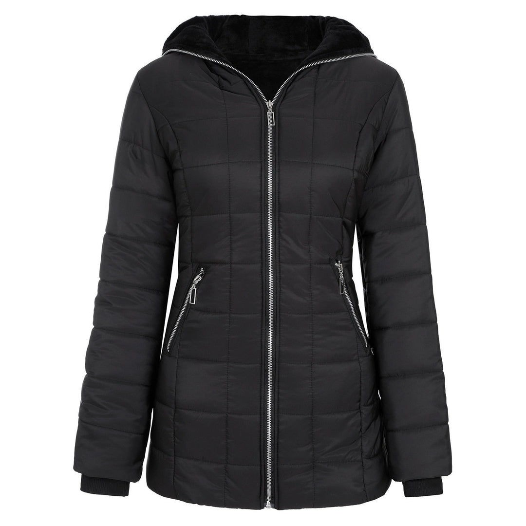 Woman wearing a chic padded winter coat, ideal for staying warm and fashionable in cold weather.