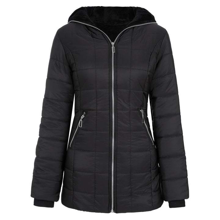 Woman wearing a chic padded winter coat, ideal for staying warm and fashionable in cold weather.