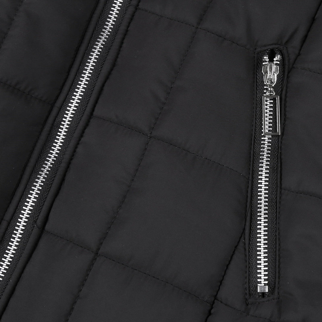 Close-up of a women's padded winter coat, showcasing its cozy collar and warm, stylish design.