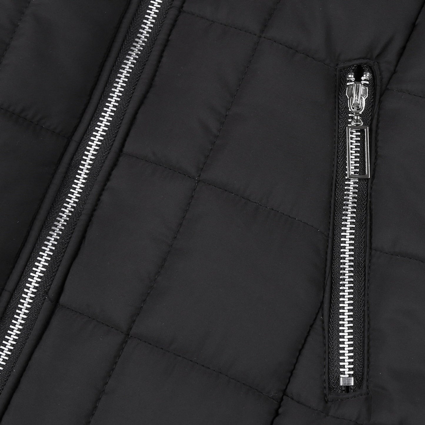 Close-up of a women's padded winter coat, showcasing its cozy collar and warm, stylish design.