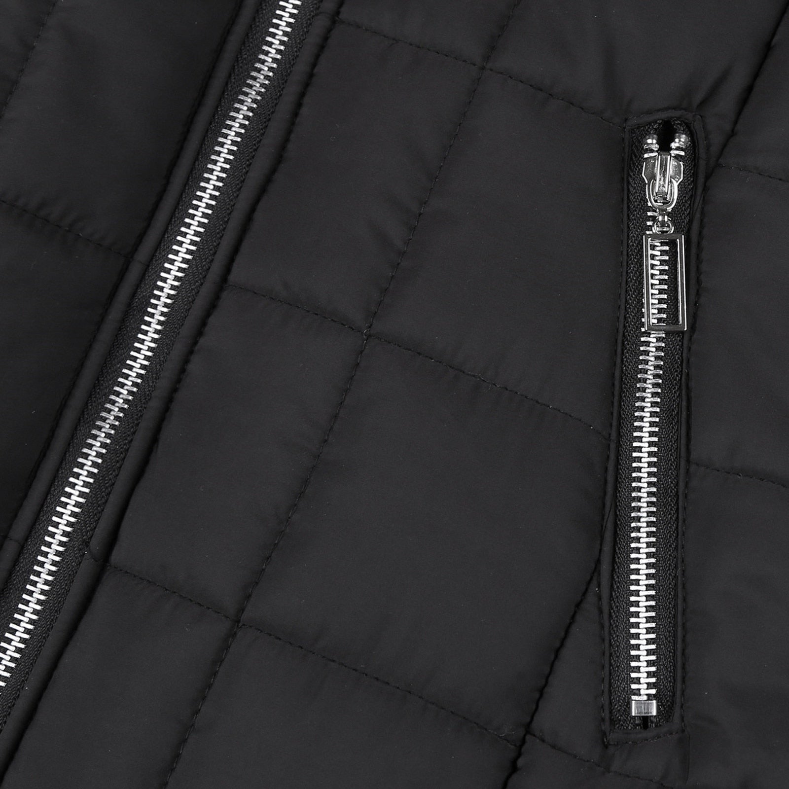 Close-up of a women's padded winter coat, showcasing its cozy collar and warm, stylish design.