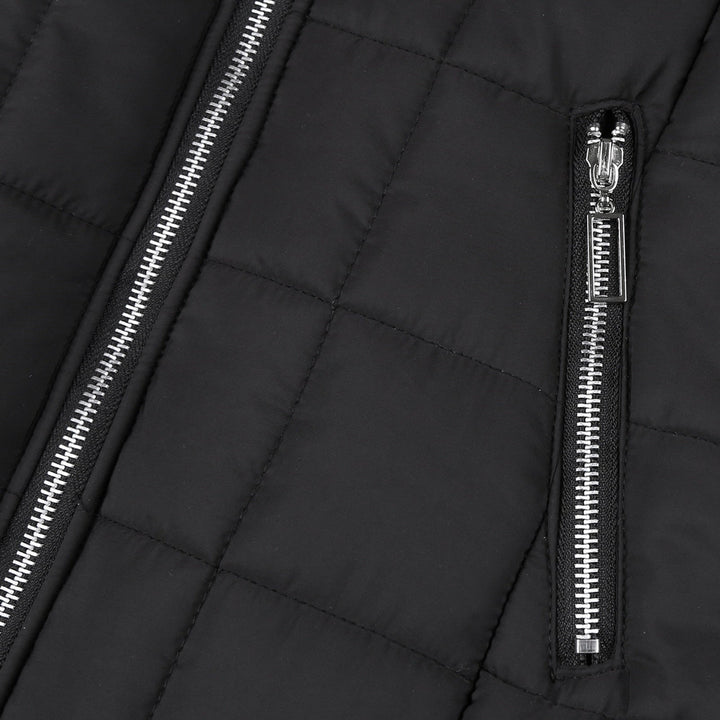 Close-up of a women's padded winter coat, showcasing its cozy collar and warm, stylish design.