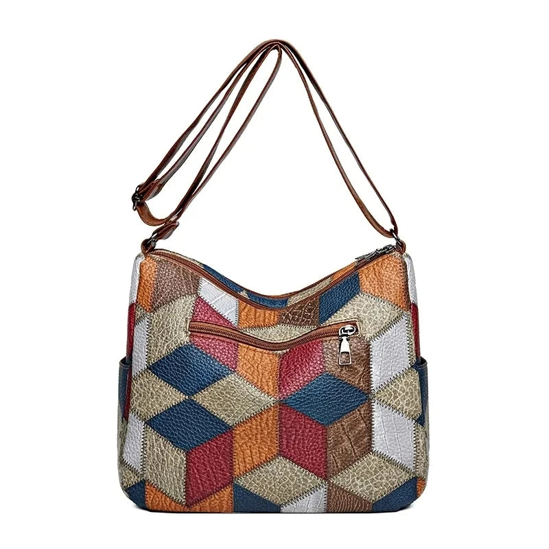 Eclectic women's patchwork handbag with multi-color blocks, durable vegan leather, unique fashion accessory.