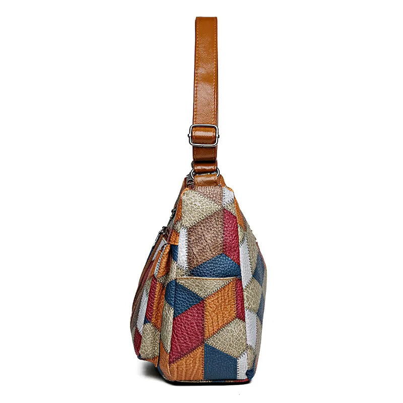 Spacious interior of women's patchwork vegan leather bag, organized compartments, practical everyday use.