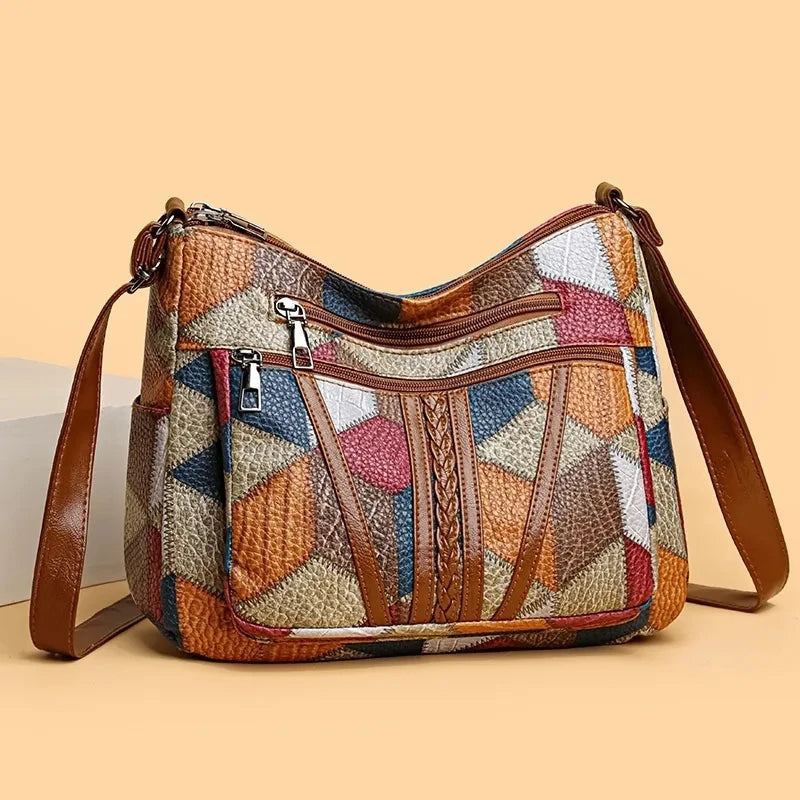 Spacious women's patchwork crossbody bag, durable vegan leather, perfect for daily essentials & travel.