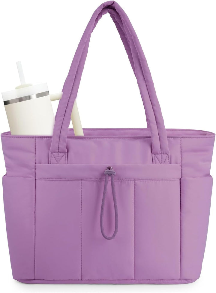 Functional women's quilted tote, cup holder and multiple pockets.