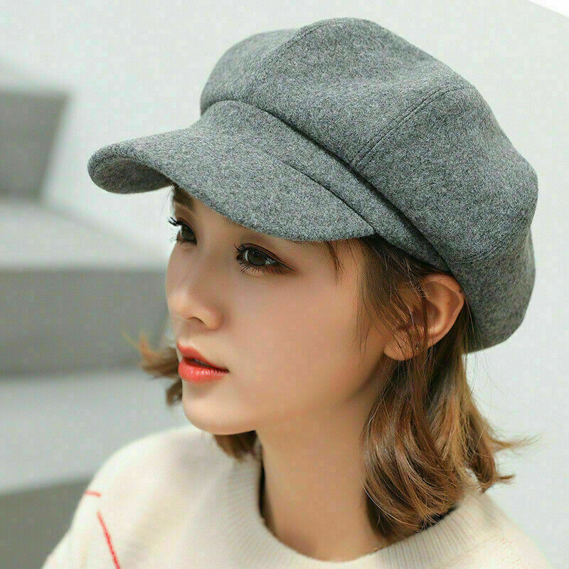 Warm women's retro balloon hat for winter. Stylish cotton headwear accessory with a vintage flair.