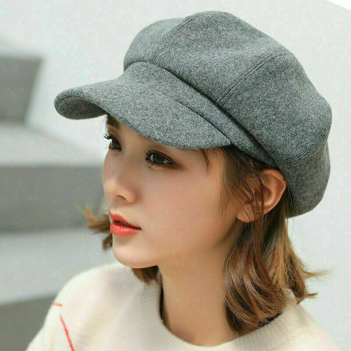 Warm women's retro balloon hat for winter. Stylish cotton headwear accessory with a vintage flair.