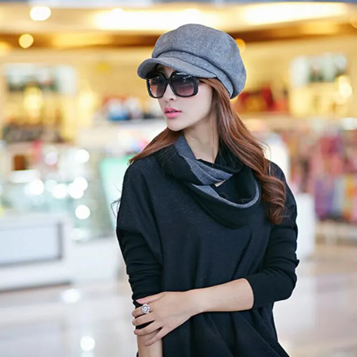 Elegant women's retro balloon hat for winter. Warm cotton vintage cap, a stylish headwear accessory.