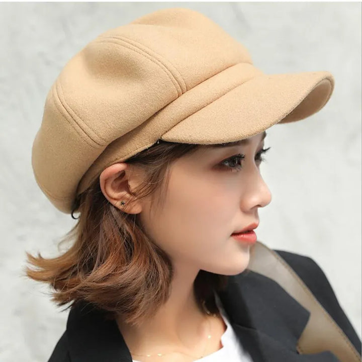 Women's retro balloon hat, a warm and stylish cotton winter cap. Vintage fashion headwear accessory.
