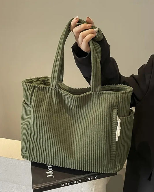 Women's stylish ribbed tote bag with unique cord detail, perfect for everyday casual carry.