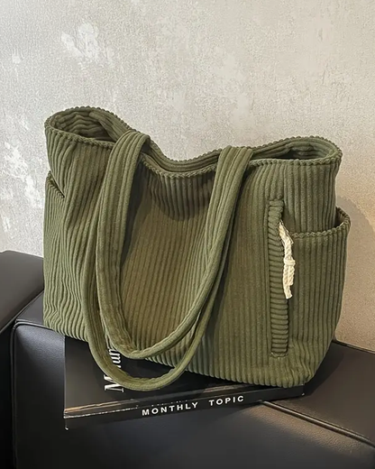 Modern women's ribbed shoulder bag, spacious for everyday essentials, chic and durable.