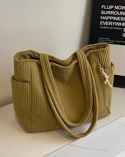 Soft ribbed women's tote bag, comfortable shoulder carry, spacious for daily essentials.