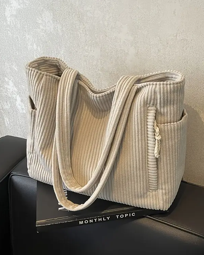 Elegant ribbed tote bag for women, stylish cord detail, versatile for everyday & casual wear.