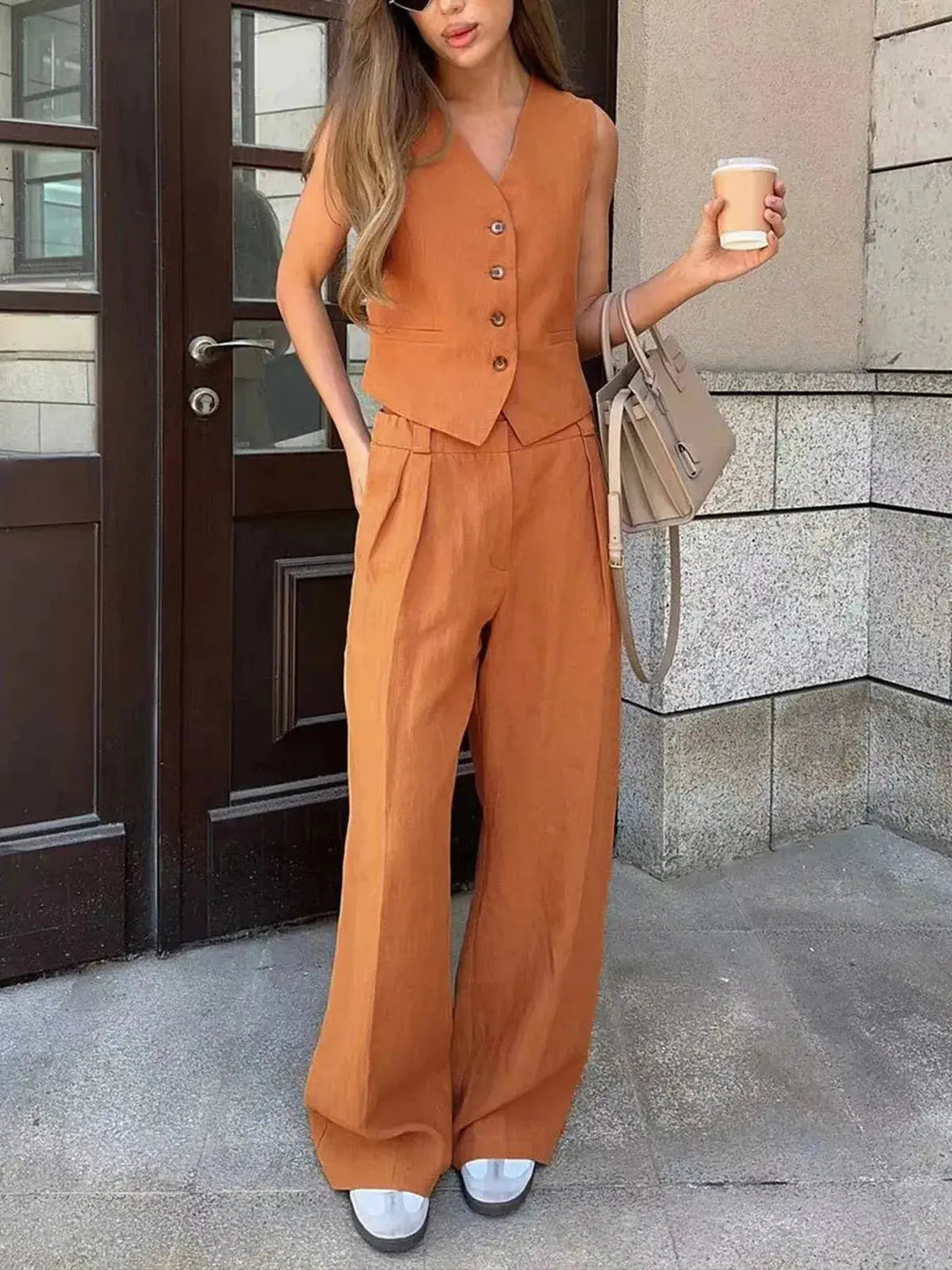Elegant women's tailored waistcoat, part of a versatile two-piece set. Ideal for spring/summer outfits.