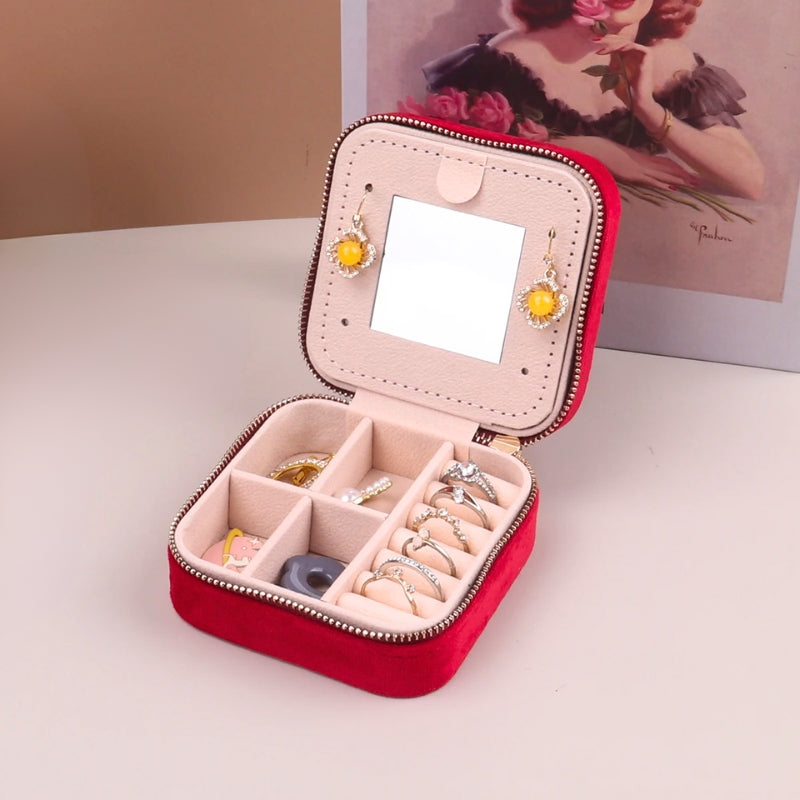 Closed, compact women's stylish velvet travel jewelry box, secure storage for precious accessories.