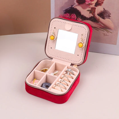 Closed, compact women's stylish velvet travel jewelry box, secure storage for precious accessories.