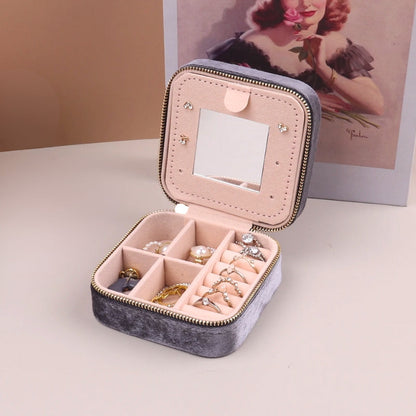 Women's portable velvet jewelry organizer, perfect for elegant accessory storage during travel.
