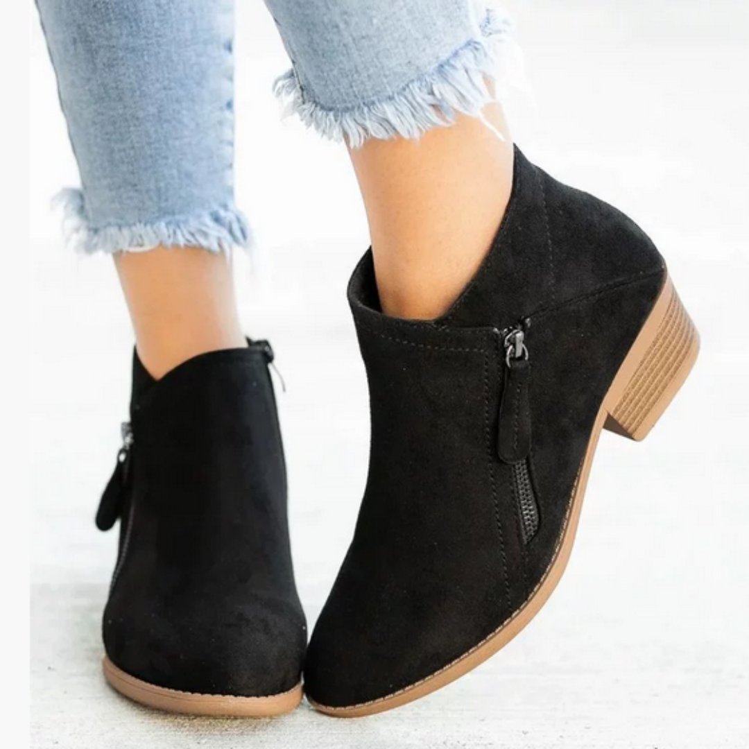 Durable sole of women's supportive waterproof boots, providing excellent grip for all-day walking comfort.
