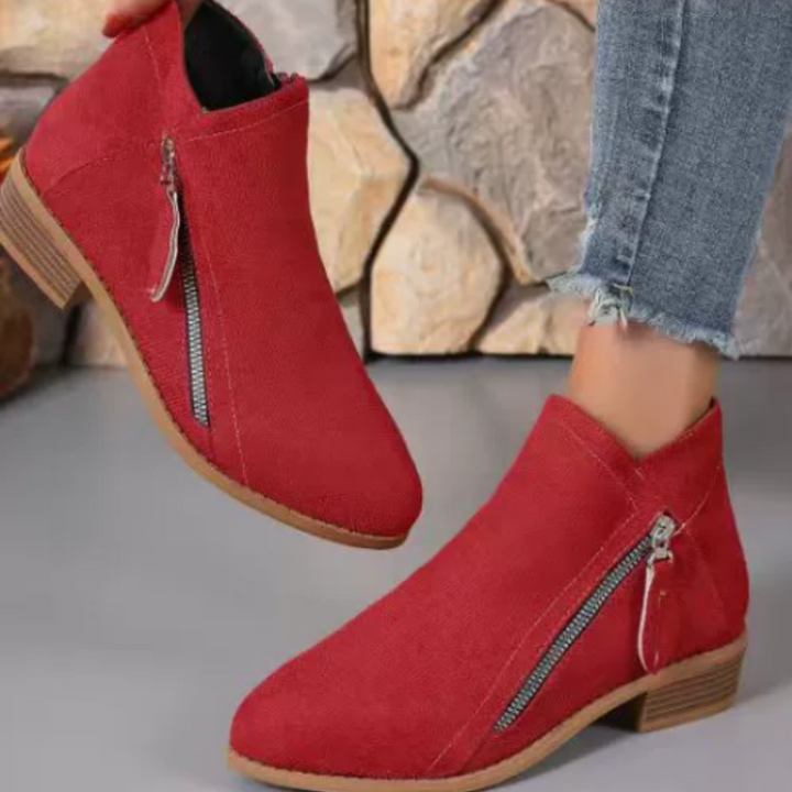 Easy-access zipper on women's comfortable waterproof ankle boots, designed for everyday wear & convenience.