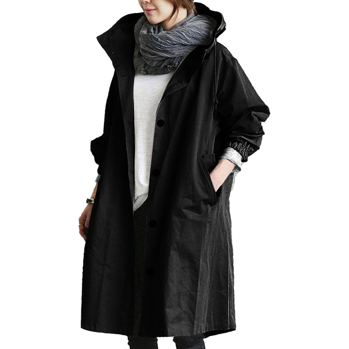 Elegant women's waterproof trench coat, long and stylish for all-weather outdoor protection.