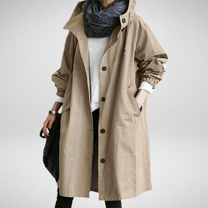 Durable women's waterproof long trench coat, ideal for outdoor protection & casual rainwear.