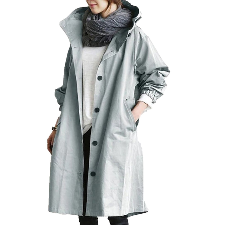 All-weather women's waterproof long raincoat, providing stylish protection for outdoor activities.
