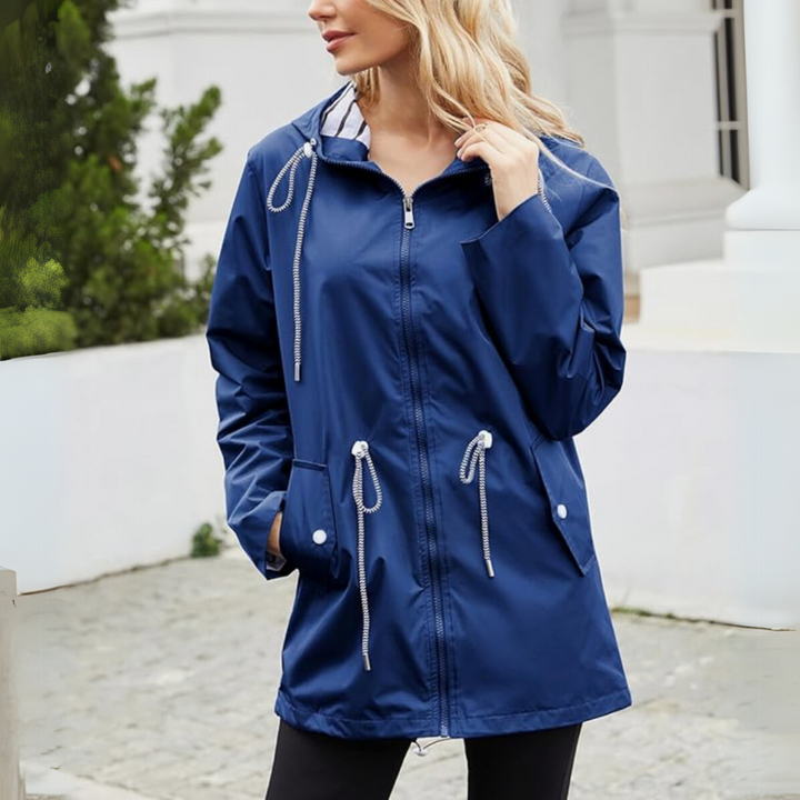 Lightweight women's waterproof jacket, ideal for easy layering and comfortable outdoor wear. Stay dry with style.