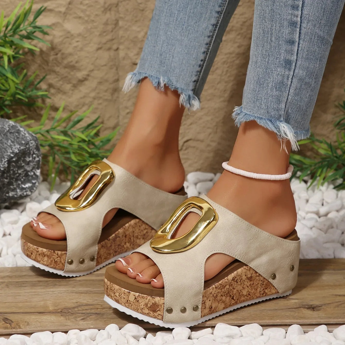 Chic women's wedges, gold accent, cushioned support for summer fashion.
