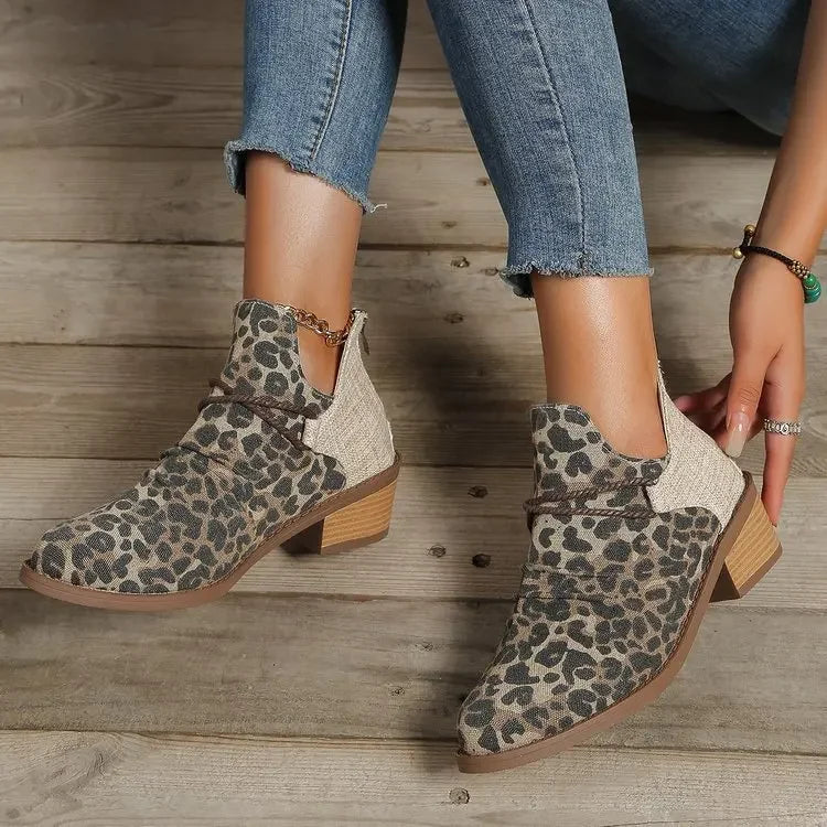 Side view of women's stylish woven ankle boots in denim blue, comfortable & fashionable.