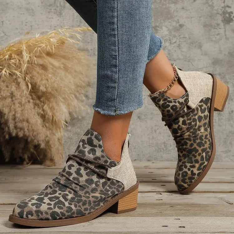 Trendy leopard print woven ankle boots for women, offering stylish comfort & block heel.