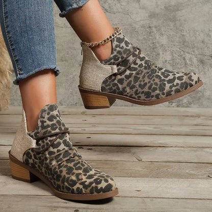 Close-up: Stylish woven texture on women's denim blue ankle boots, comfort footwear.